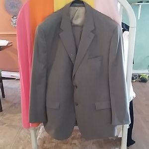 Jason abboud gray stripped suit 100% wool.
